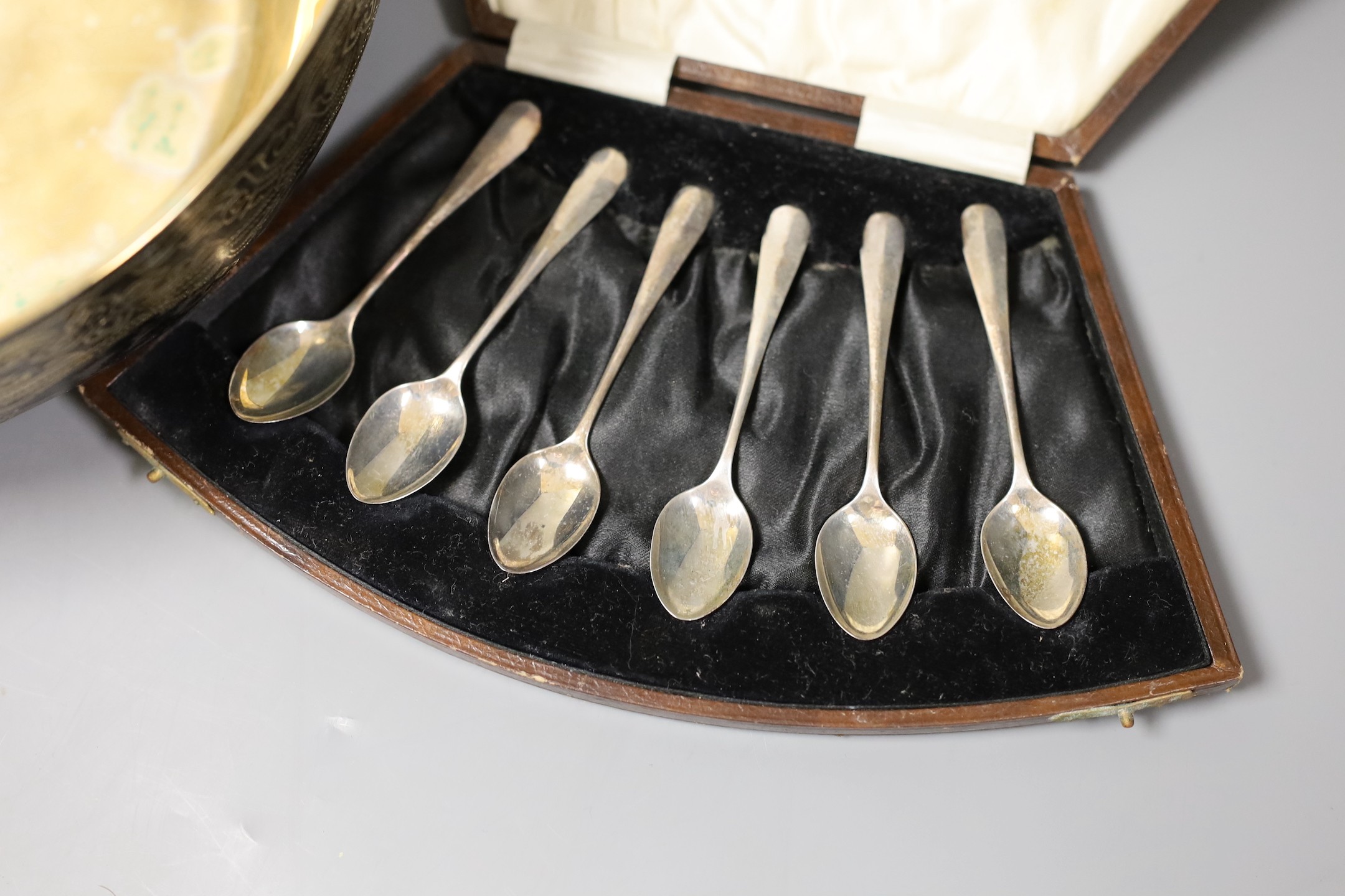 Assorted silver and other items including two silver mounted photograph frames, a Georgian silver mustard by John Eames, a graduated suite of three Victorian silver mounted horn beakers, a silver candle extinguisher, a c